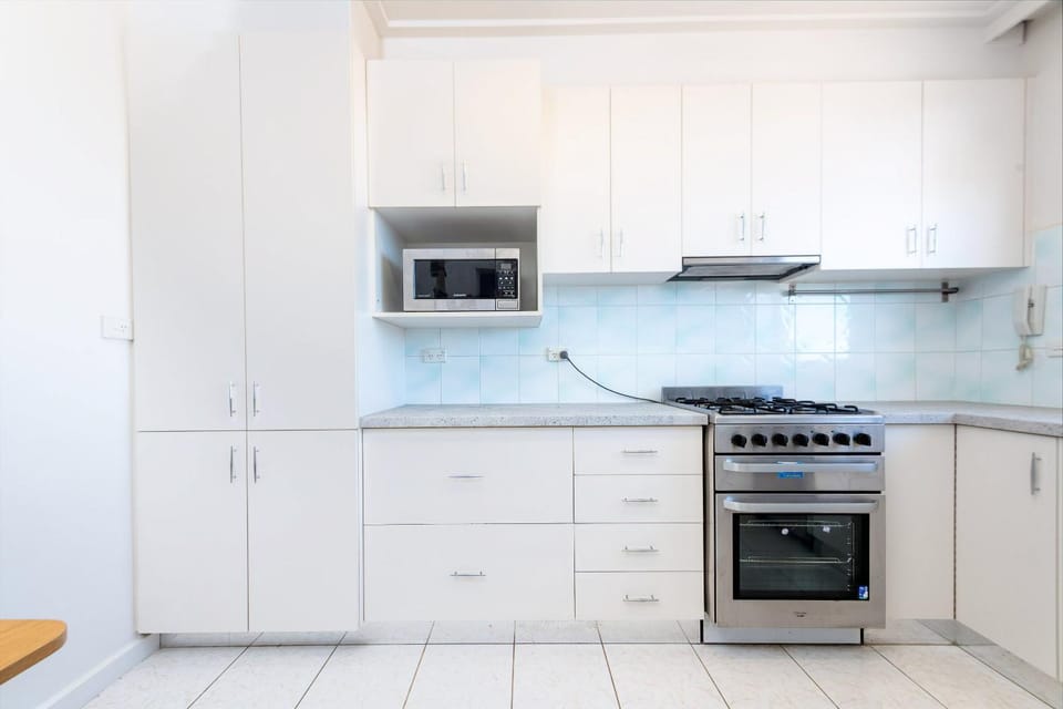 Kitchen or kitchenette, microwave, oven, stove