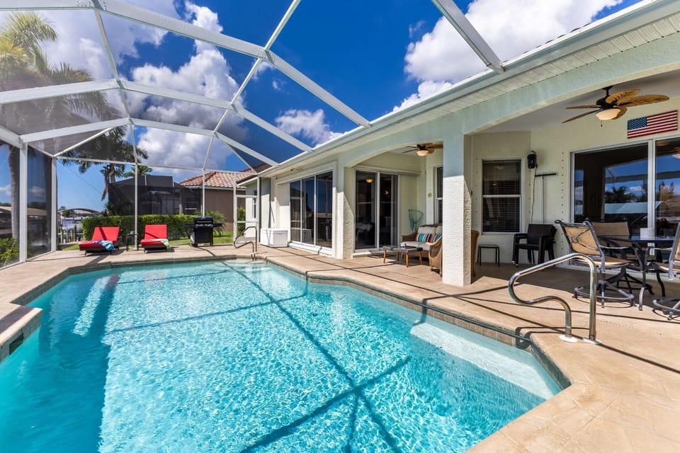 Fun Gulf-Access Retreat with Heated Pool, Dock & Tiki Hut Getaway - Villa Gone Coastal - Roelens House in Cape Coral