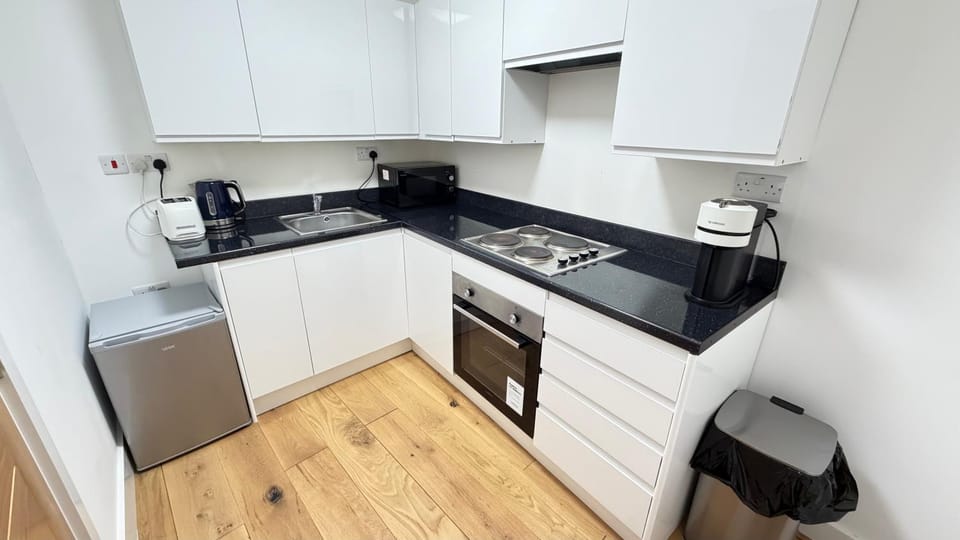 Kitchen or kitchenette, stove, toaster