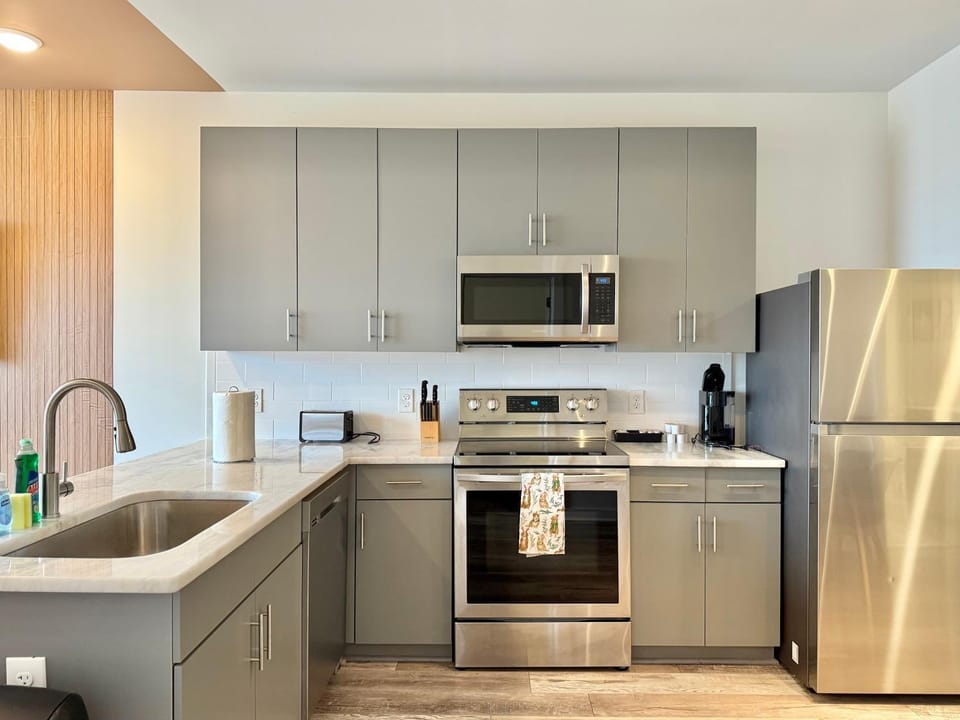 Kitchen or kitchenette, dishwasher, oven, stove, toaster