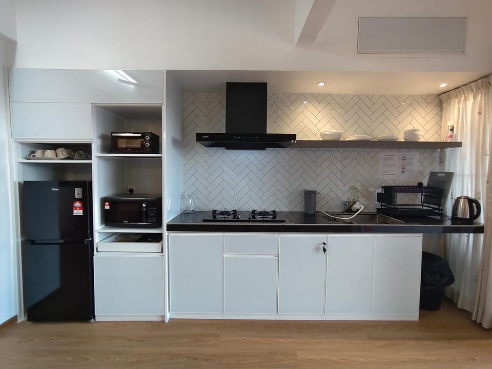 Kitchen or kitchenette, microwave, stove, toaster