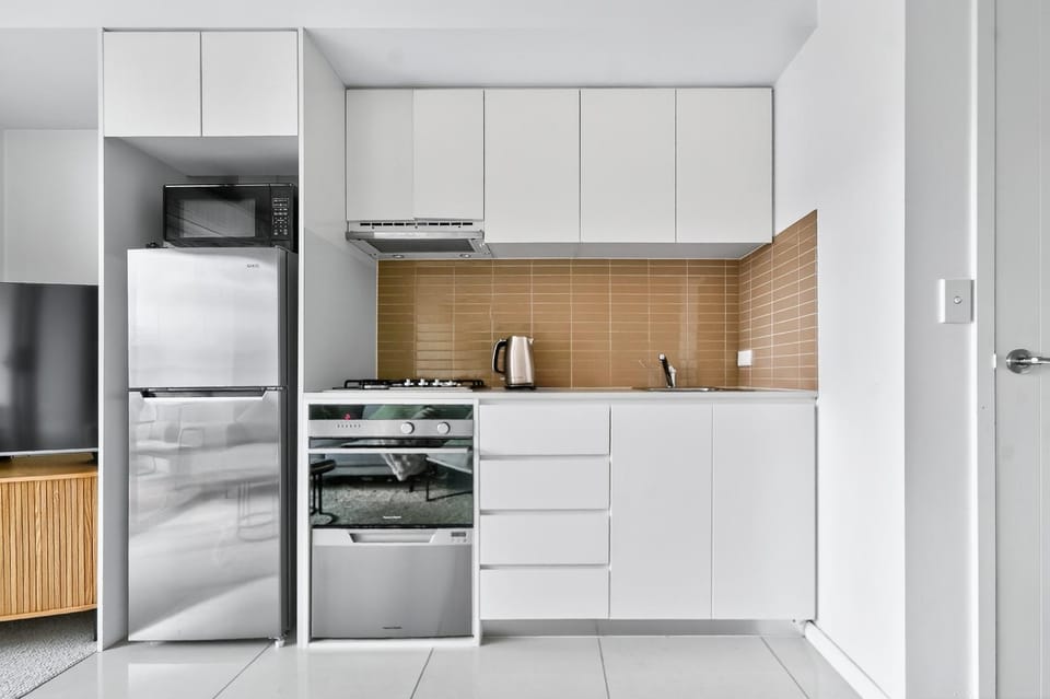Kitchen or kitchenette, dishwasher, microwave, oven