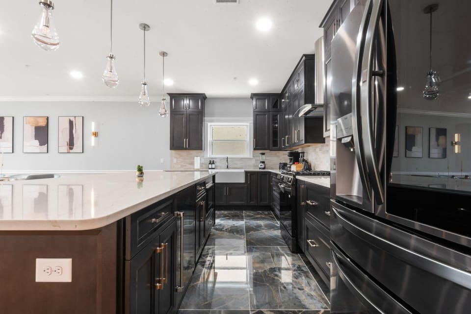 Kitchen or kitchenette, dishwasher, oven, stove