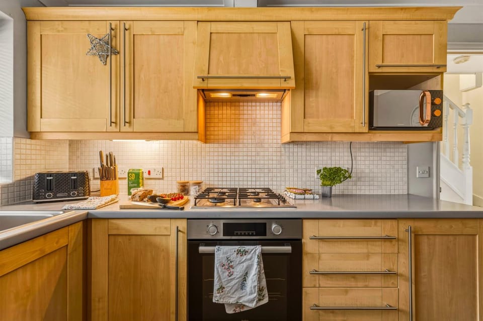 Kitchen or kitchenette, microwave, oven, stove, toaster