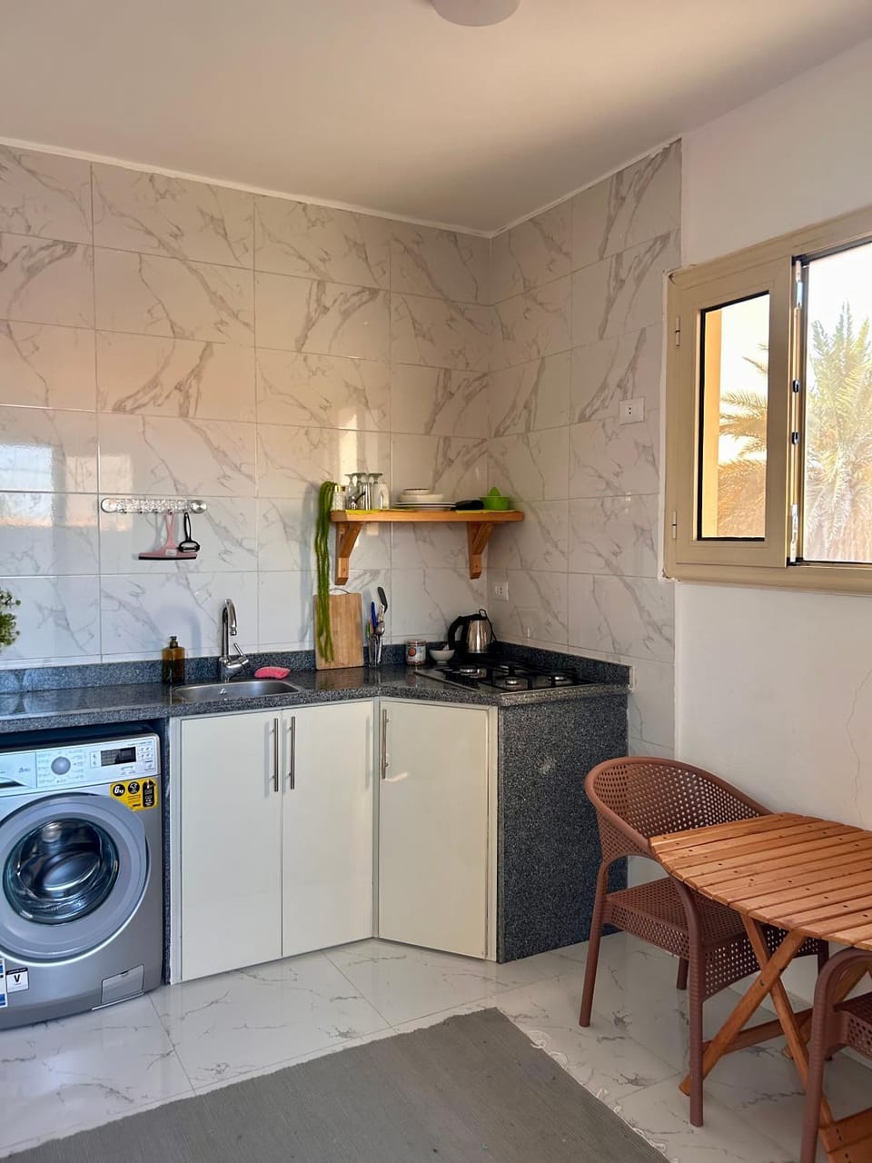 Kitchen or kitchenette, washing machine