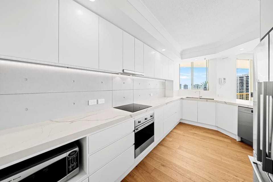 Kitchen or kitchenette, dishwasher, oven, stove