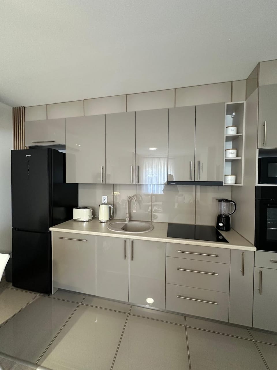 Kitchen or kitchenette, dishwasher, oven, stove