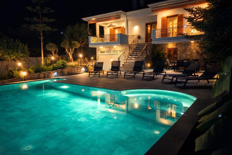 Property building, Patio, Night, Natural landscape, Pool view, Swimming pool, sunbed