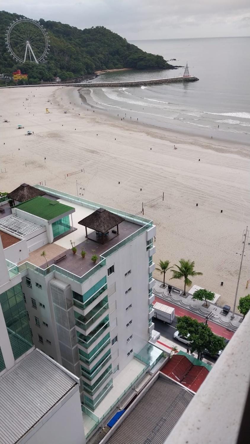 Building facing the sea Side view of Ferris Wheel Apartment in Camboriú