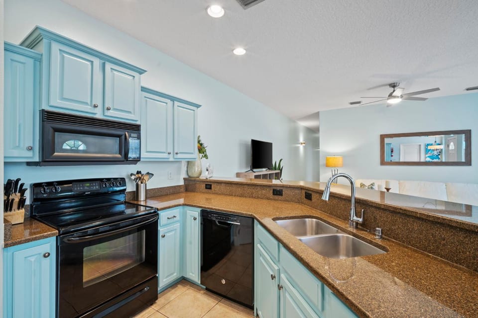 Kitchen or kitchenette, dishwasher, oven, stove