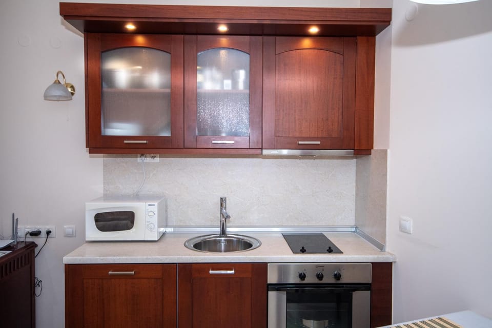 Kitchen or kitchenette, stove, toaster