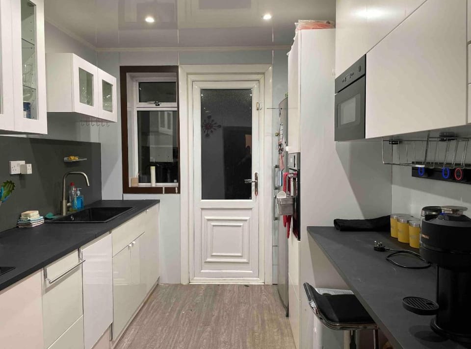 Kitchen or kitchenette, dishwasher, oven, stove