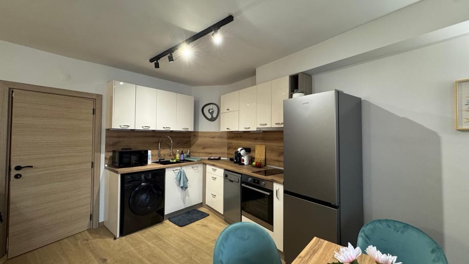 Kitchen or kitchenette, dishwasher, oven, stove