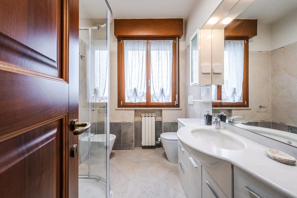 Shower, Toilet, Bathroom, hair dryier, towels, washing machine, dryer