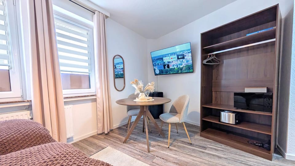 TV and multimedia, Seating area, Dining area, furniture, hair dryier, microwave, storage, toaster, wardrobe