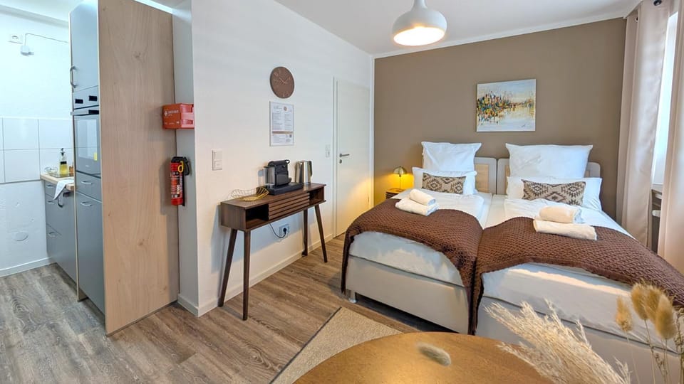 Bed, Coffee/tea facilities, Kitchen or kitchenette, Bedroom, dishwasher, furniture, oven, towels, kitchen