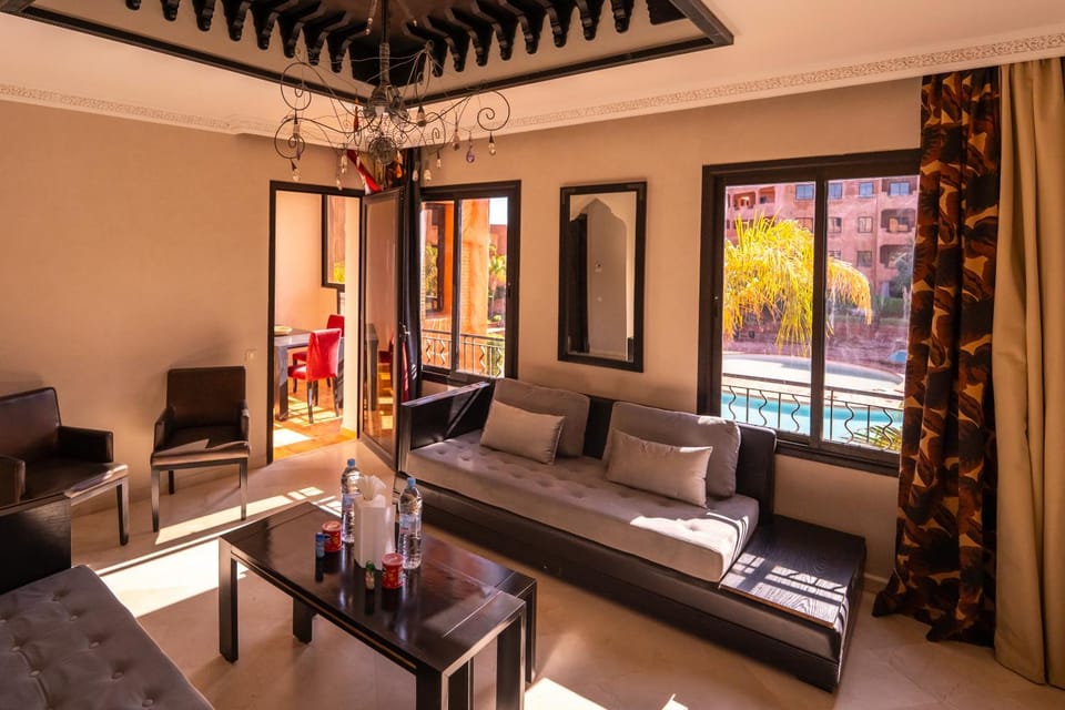 Living room, Seating area, Dining area, Pool view
