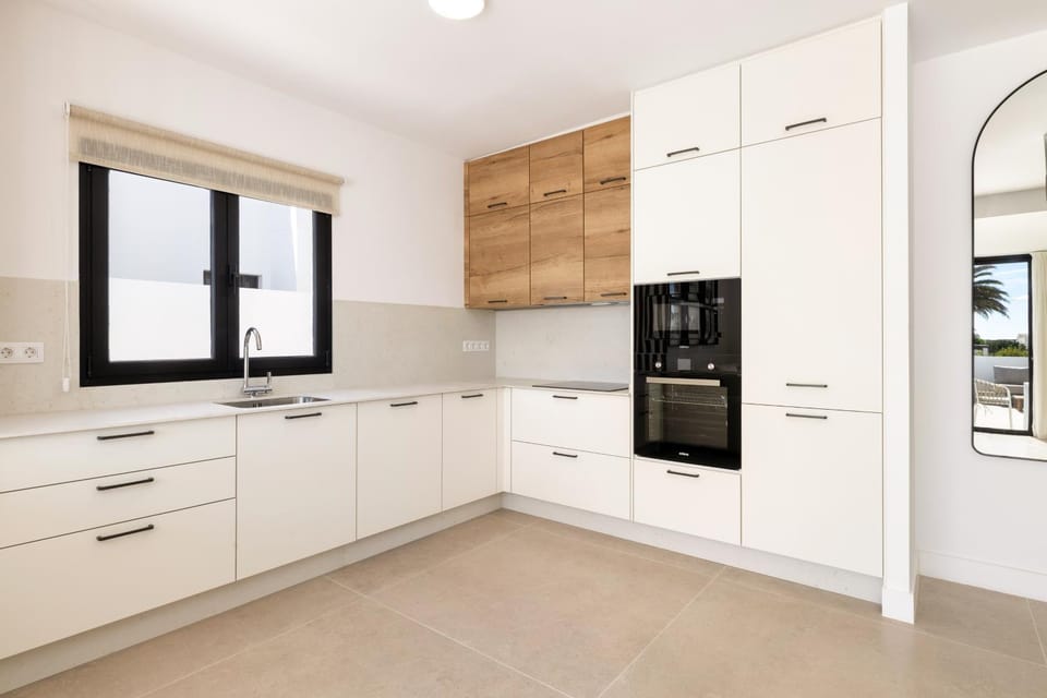 Kitchen or kitchenette, dishwasher, oven, stove