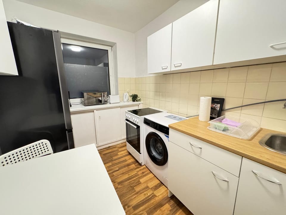 Kitchen or kitchenette, oven, stove, toaster, washing machine, dryer