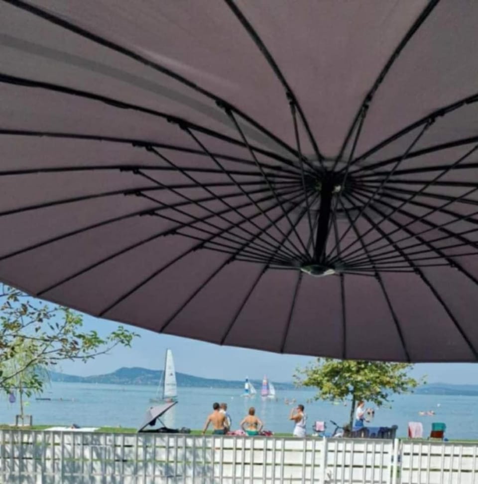 Property building, Patio, Nearby landmark, Day, Natural landscape, Lake view, group of guests