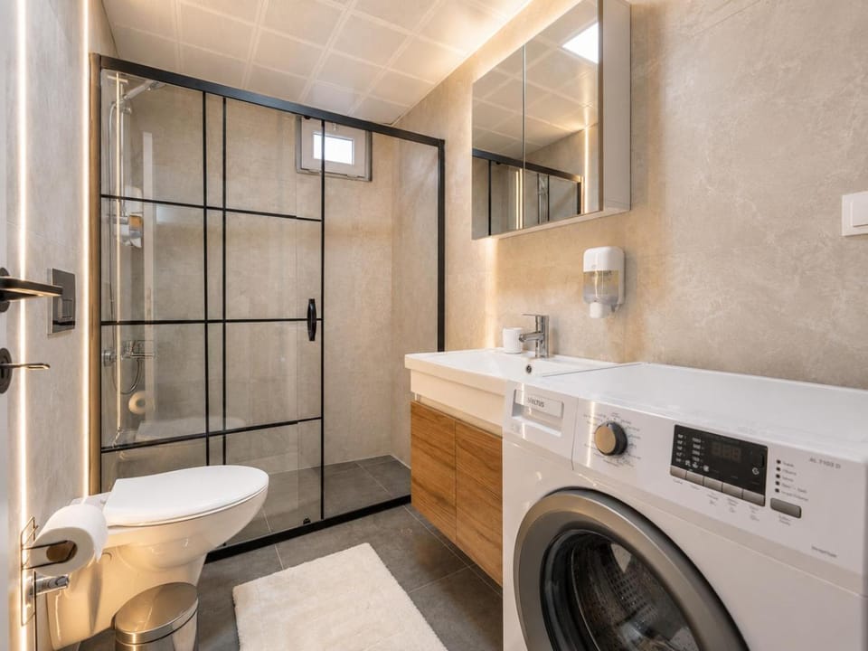 Shower, Toilet, Bathroom, towels, washing machine, dryer