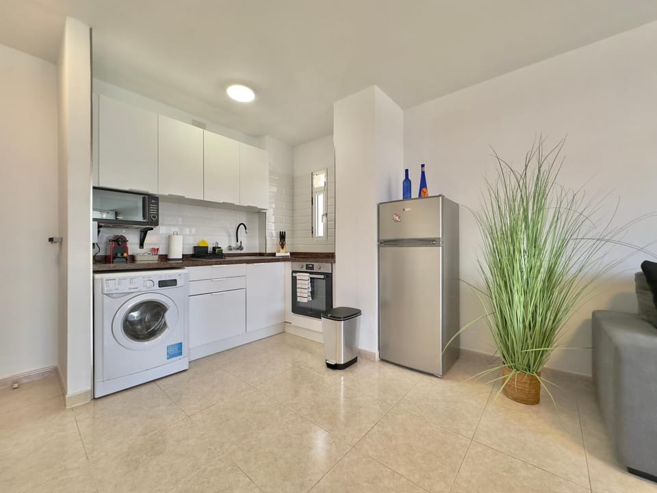 Kitchen or kitchenette, oven, stove, washing machine, kitchen