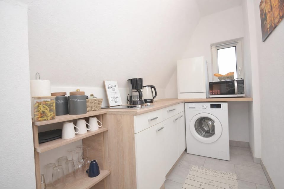 Kitchen or kitchenette, stove, washing machine