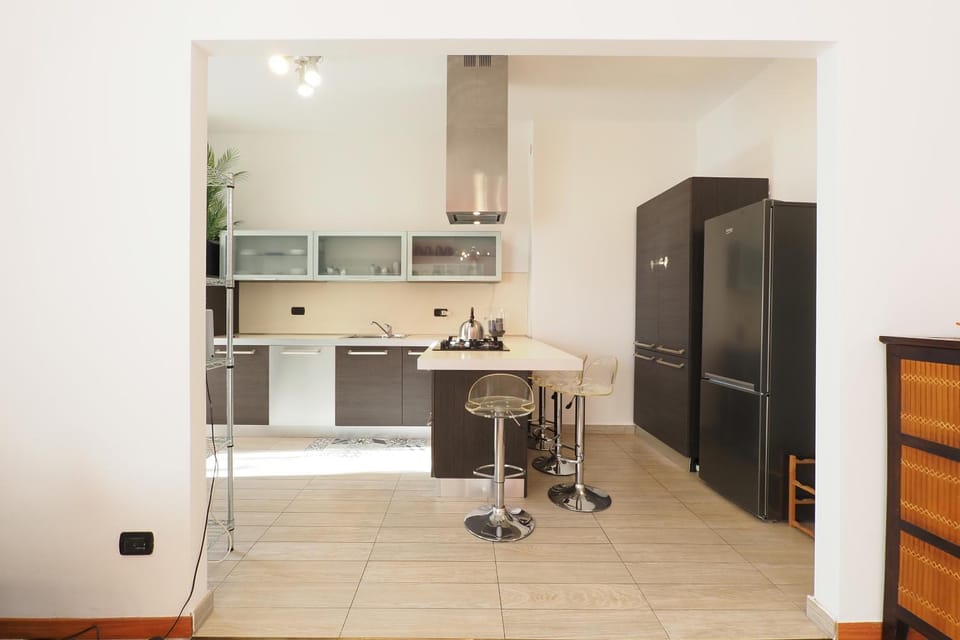 Kitchen or kitchenette, dishwasher, oven, stove