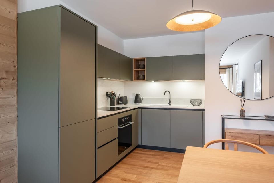 Kitchen or kitchenette, dishwasher, oven, stove