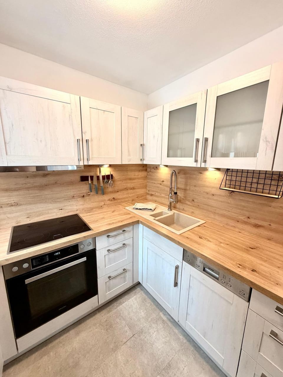 Kitchen or kitchenette, dishwasher, oven, stove