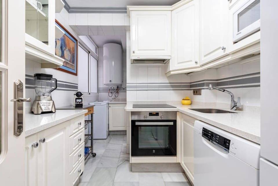Kitchen or kitchenette, dishwasher, oven, stove, toaster