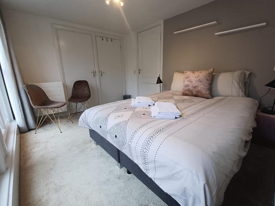 Bed, Seating area, Bedroom, towels, wardrobe