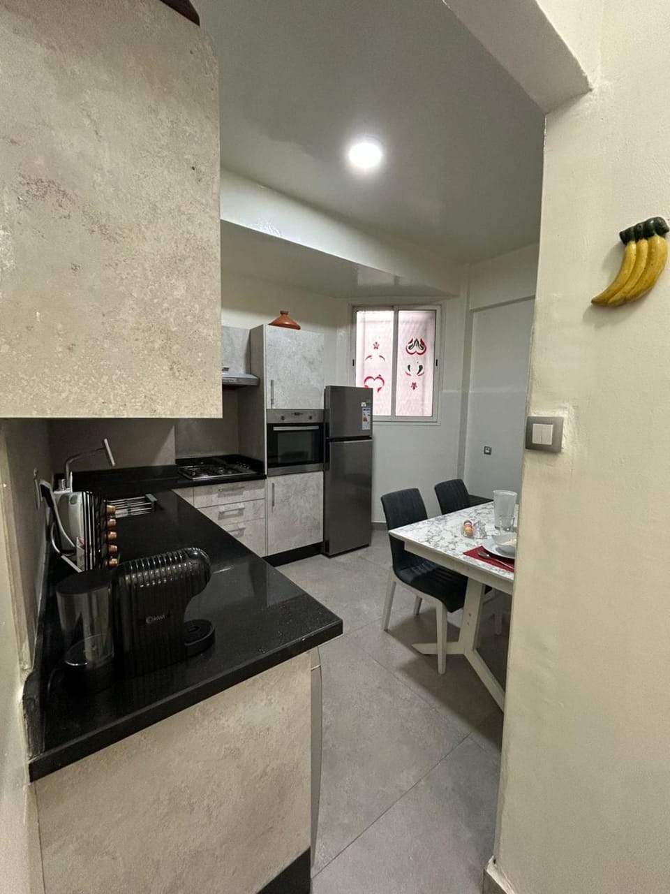 Kitchen or kitchenette, dishwasher, oven, stove
