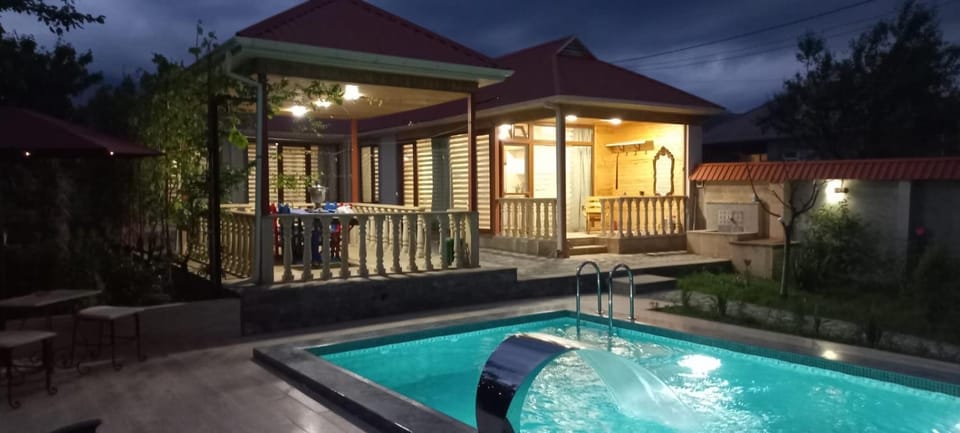 Property building, Patio, Natural landscape, Pool view, Swimming pool, sunbed