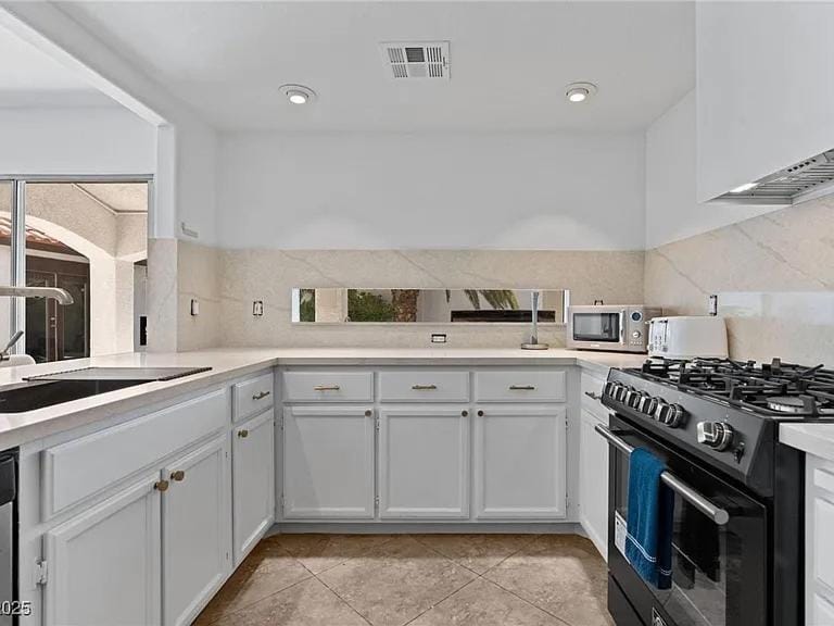 Kitchen or kitchenette, dishwasher, oven, stove, toaster