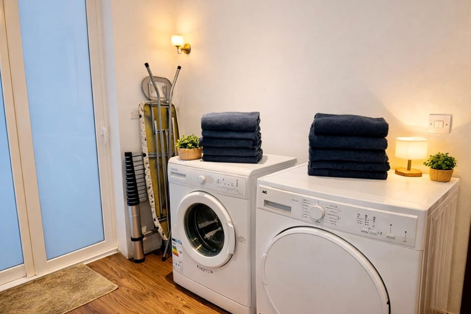 flat iron, towels, washing machine, dryer