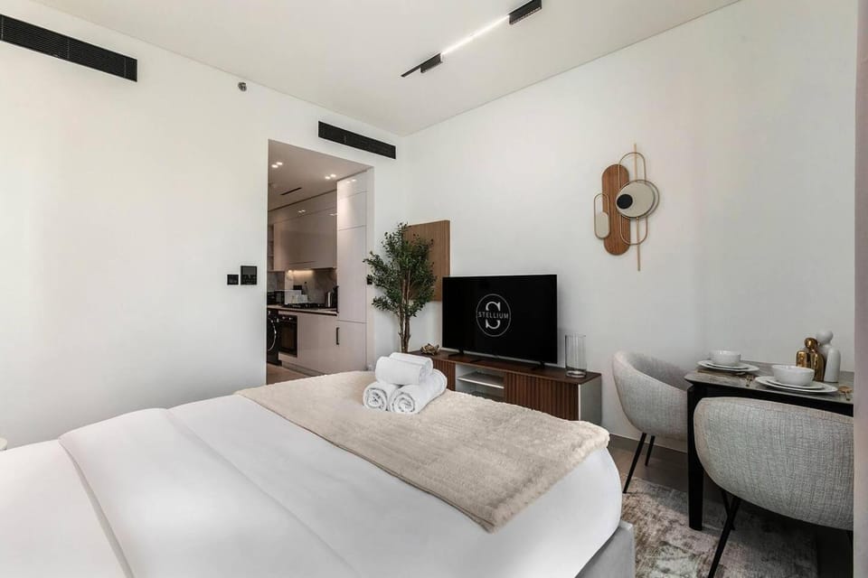 Stylish 1BR Studio Unit Balcony & Pool Apartment in Dubai