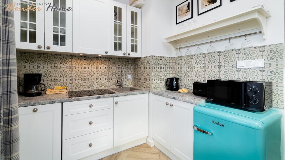 Kitchen or kitchenette, dishwasher, microwave, stove, toaster