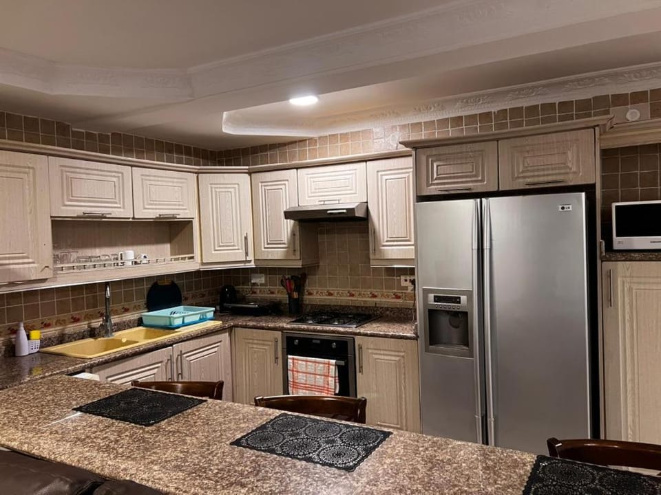 Kitchen or kitchenette, dishwasher, oven, stove