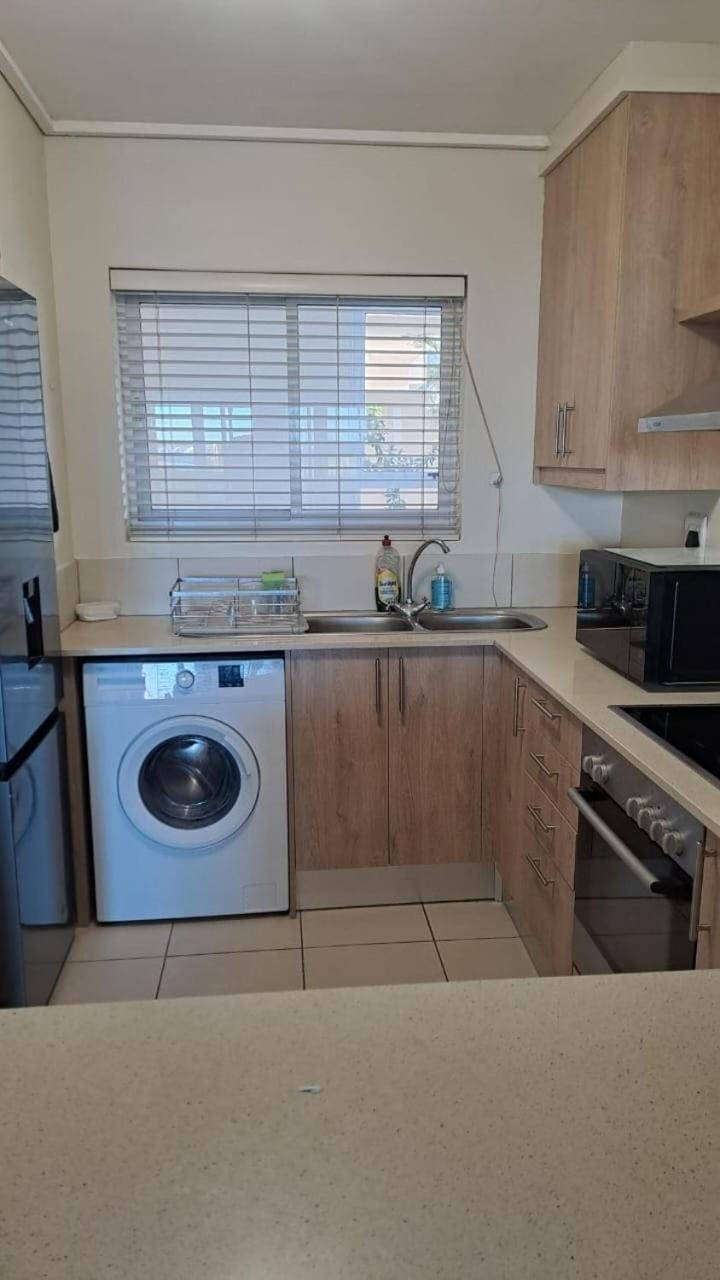 Kitchen or kitchenette, oven, stove, washing machine