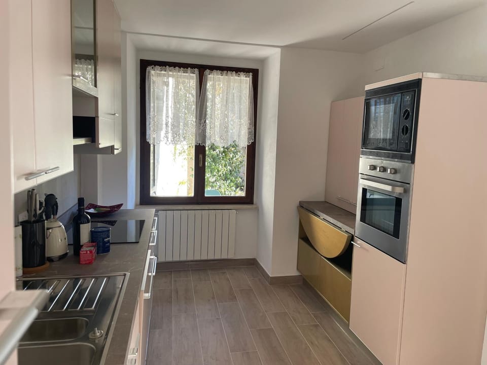 Kitchen or kitchenette, dishwasher, oven, stove