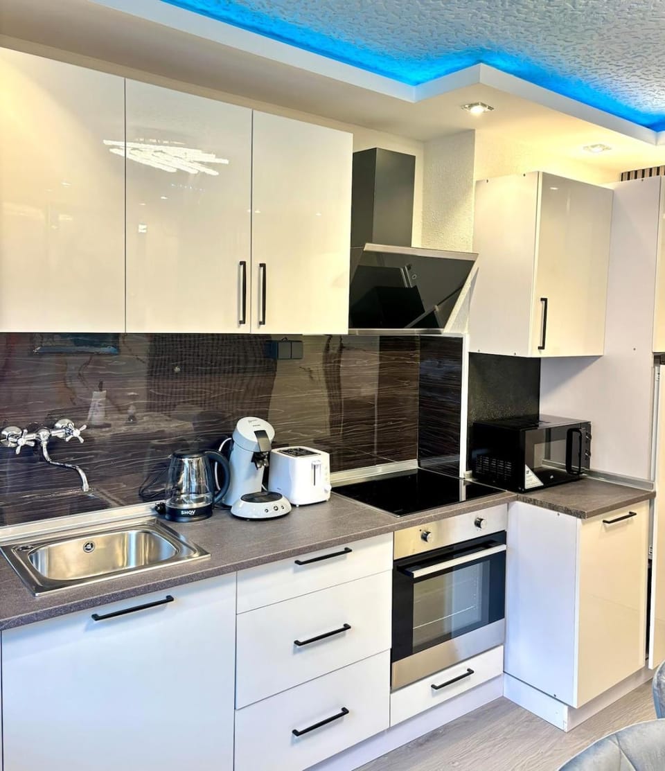 Kitchen or kitchenette, microwave, oven, stove, toaster, kitchen