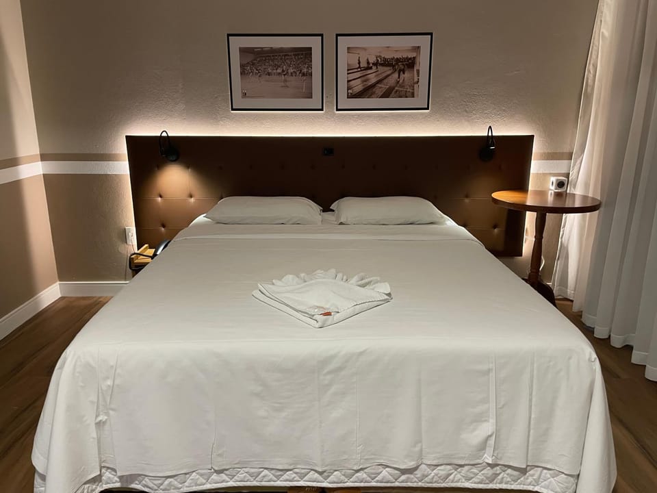 Bed, Photo of the whole room, Decorative detail, Bedroom, towels, air conditioner