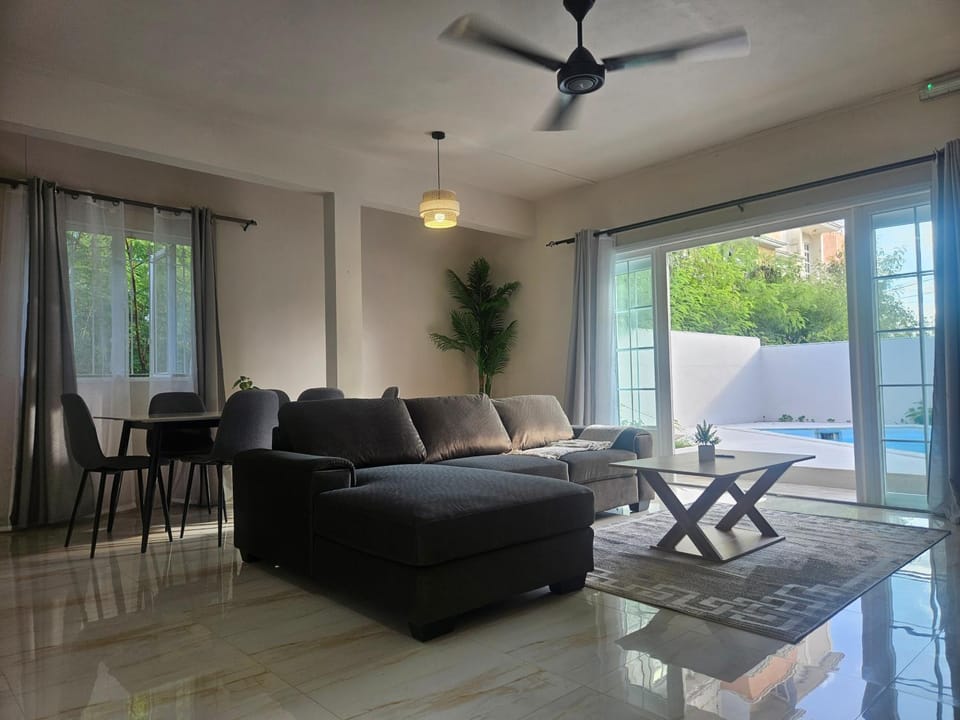 Living room, Seating area, Pool view