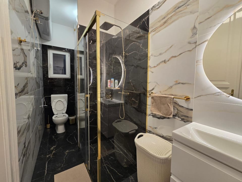 Shower, Toilet, Bathroom, hair dryier, towels