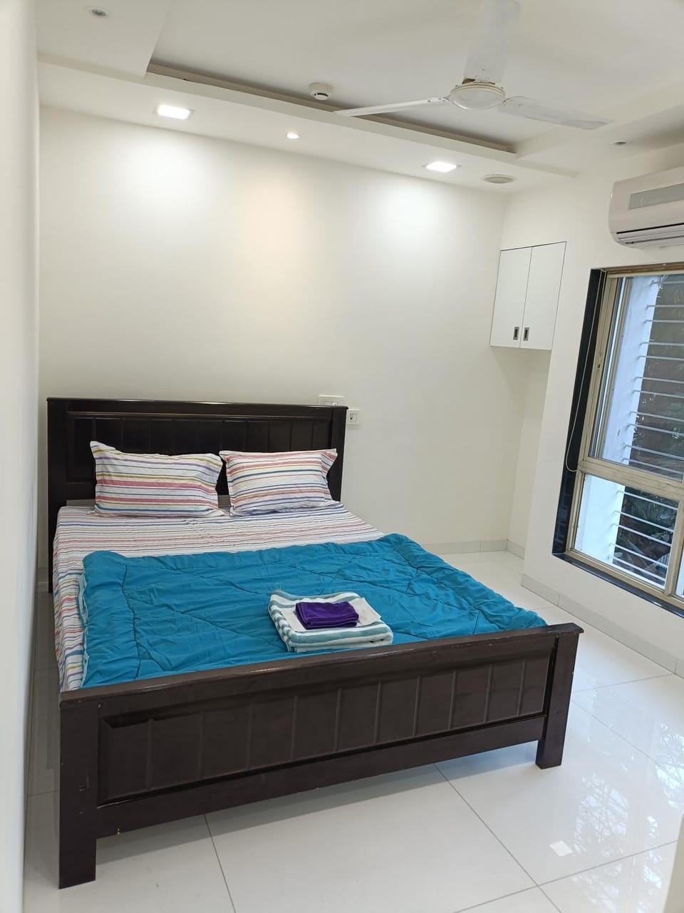 Cozy Bedroom in Aurafarm Apartment in Pune