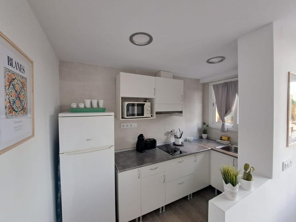 Kitchen or kitchenette, stove, toaster