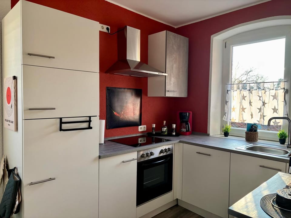 Kitchen or kitchenette, dishwasher, oven, stove