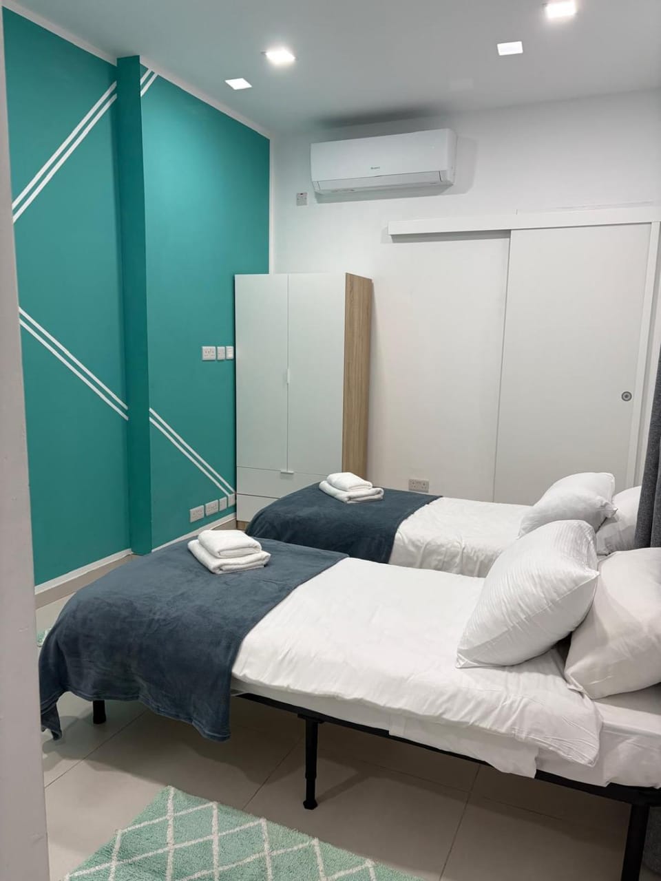 Bed, Photo of the whole room, Bedroom, towels, air conditioner