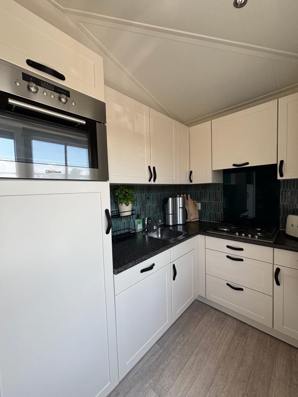 Kitchen or kitchenette, dishwasher, stove, toaster
